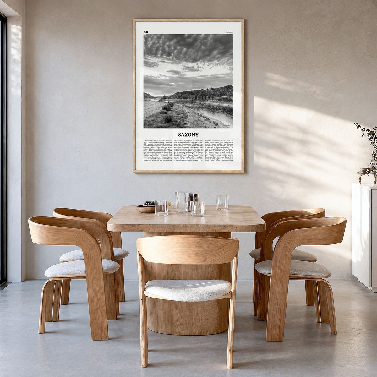 Saxony Newspaper Poster in a natural wood frame, hanging in a dining room