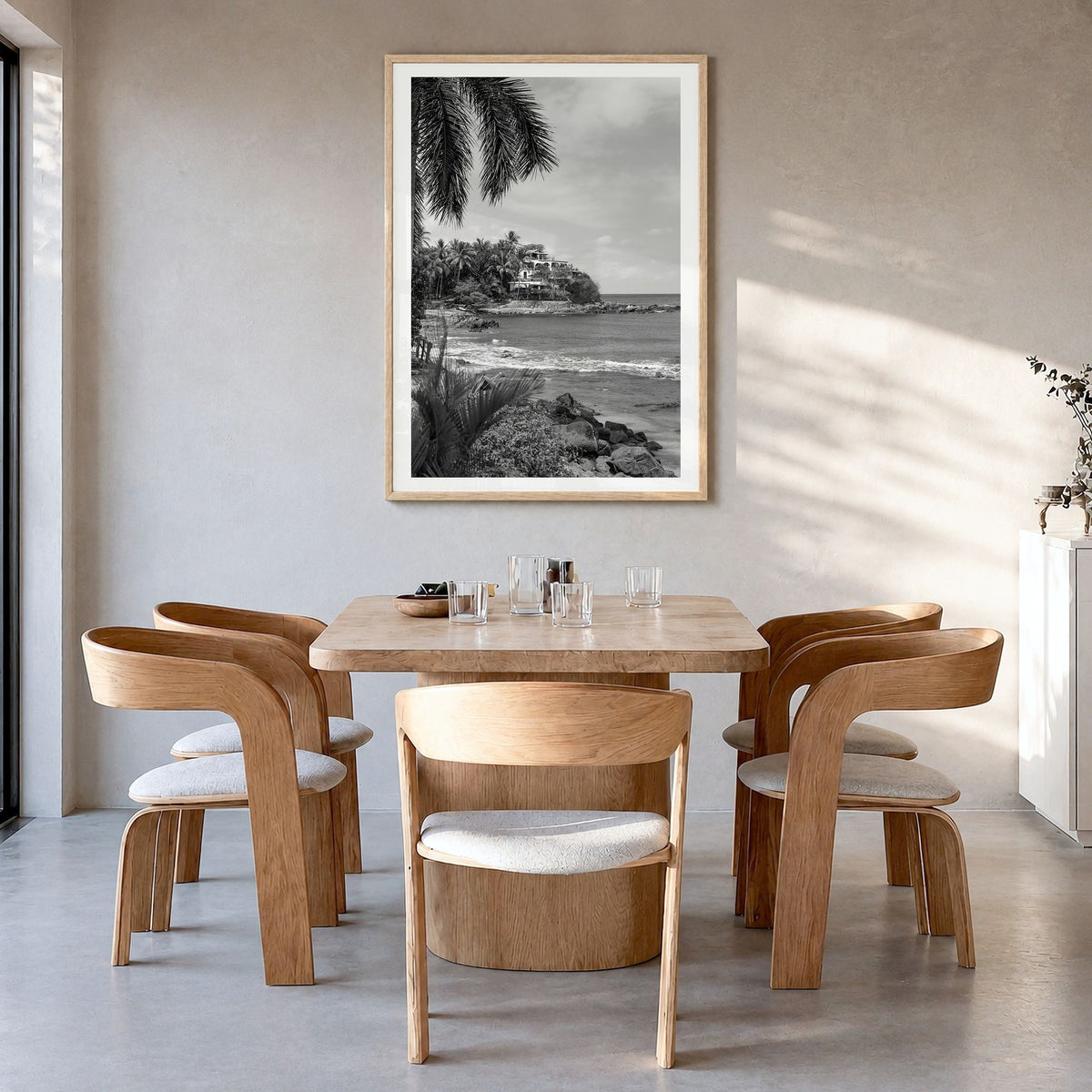 Sayulita Photo Poster in a natural wood frame, hanging in a dining room, white border