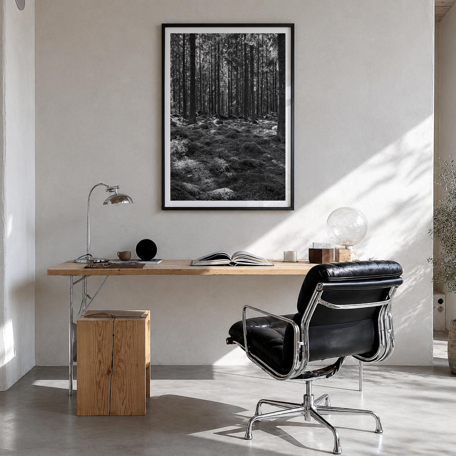 Scandinavian Forest black & white photo poster – vertical wall art in black wood frame with white border, hanging on wall