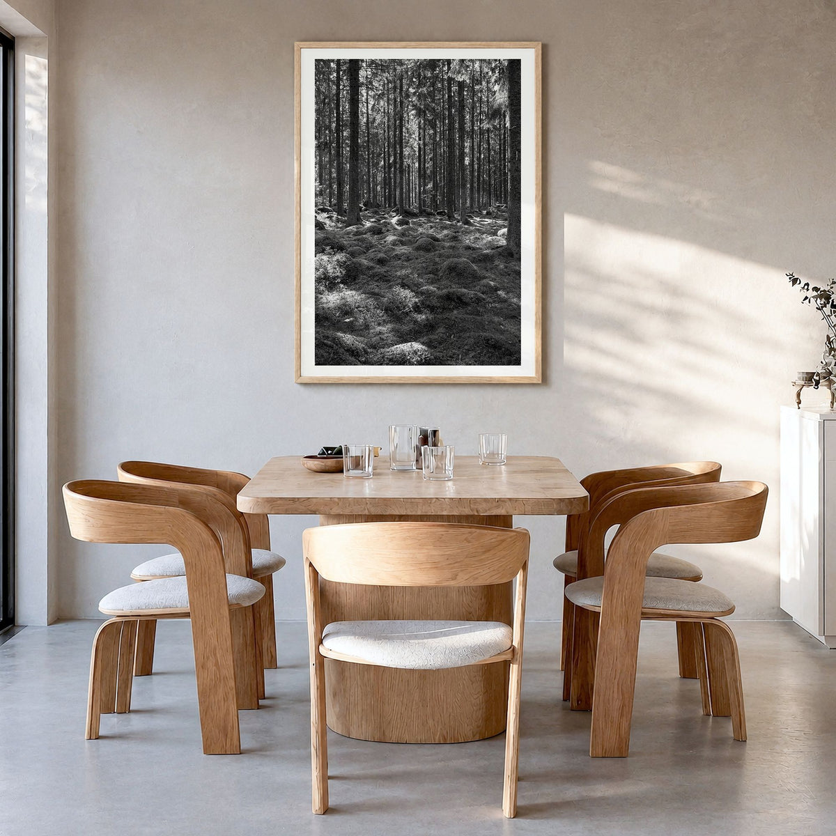 Scandinavian Forest Photo No 2 Poster in a natural wood frame, hanging in a dining room, white border