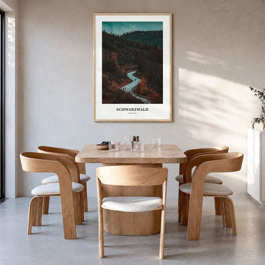 Schwarzwald Classic Poster in a natural wood frame, hanging in a dining room