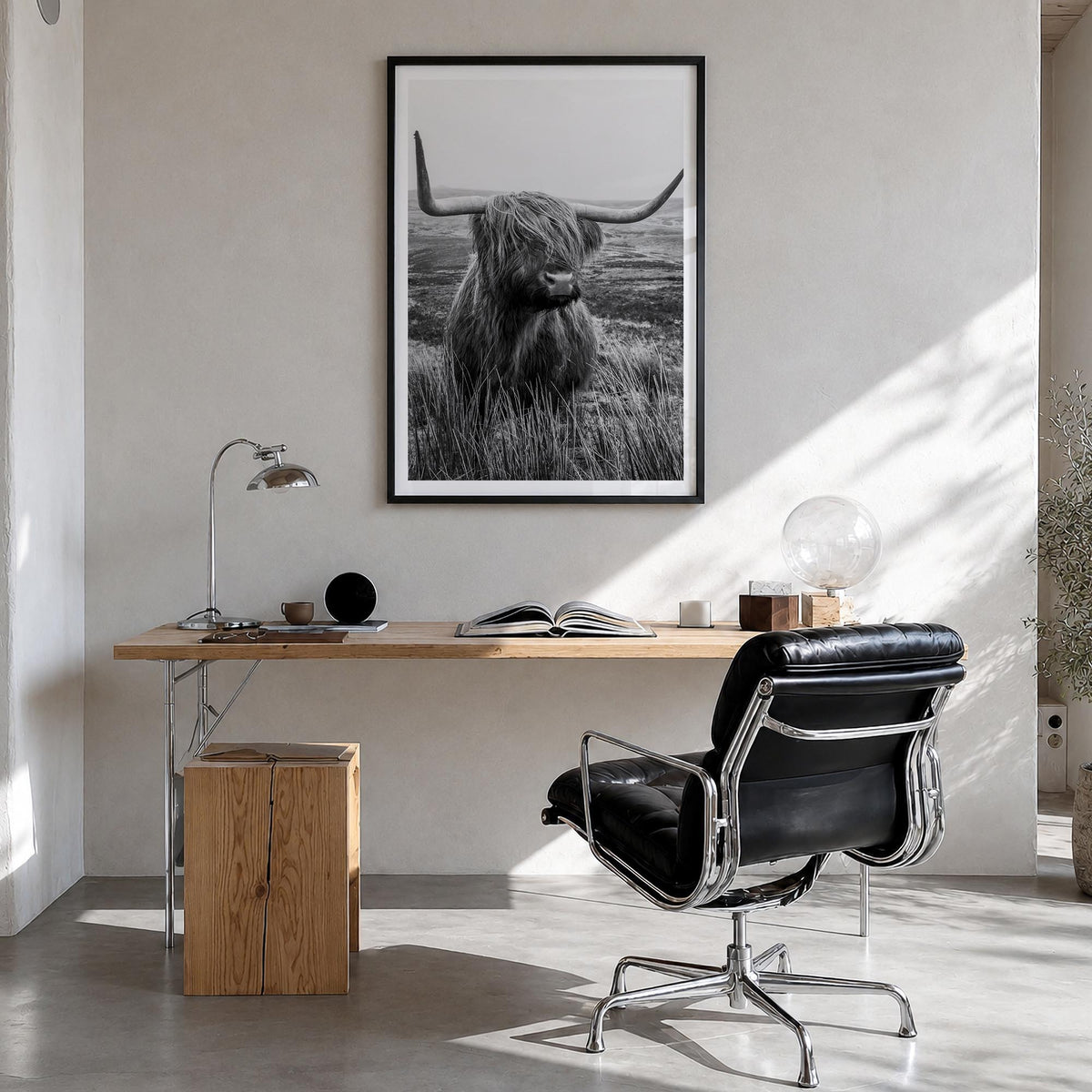 Scottish Highlander no. 1 black & white photo poster – vertical wall art in black wood frame with white border, hanging on wa