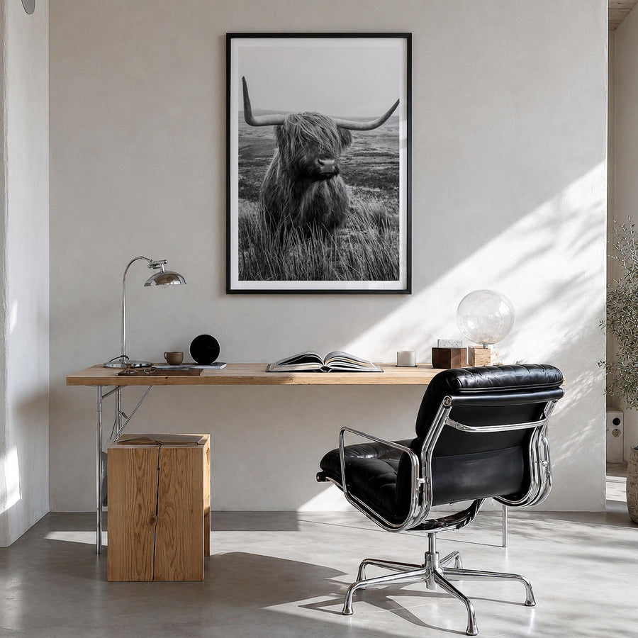 Scottish Highlander no. 1 black & white photo poster – vertical wall art in black wood frame with white border, hanging on wa