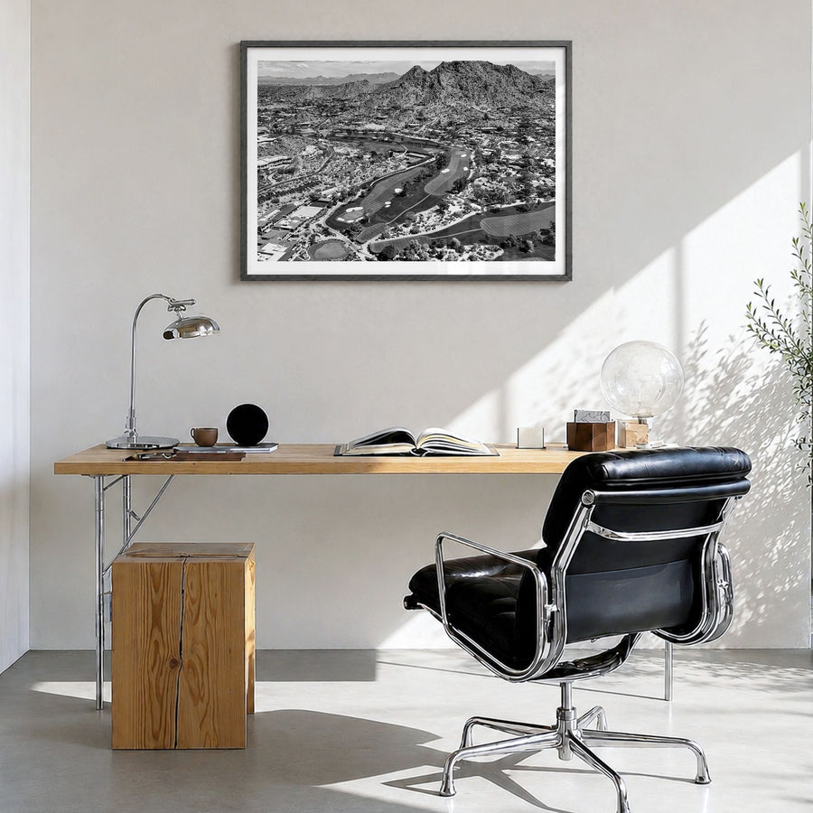 Scottsdale Photo Poster in a black wood frame, hanging in a bright home office, white border