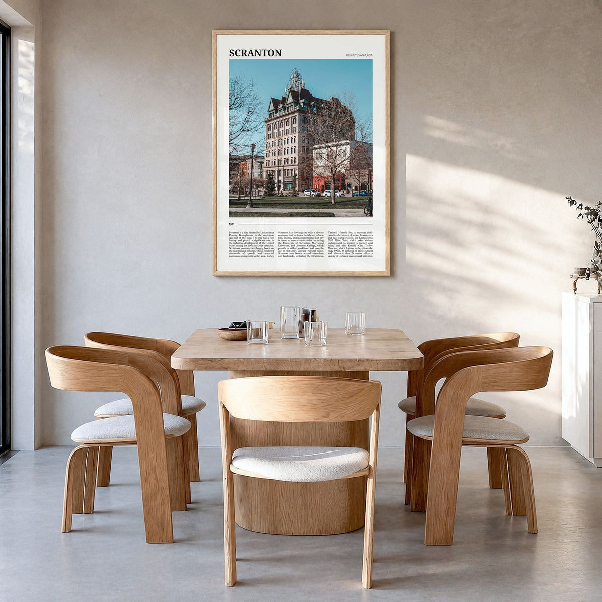 Scranton Travel Poster in a natural wood frame, hanging in a dining room