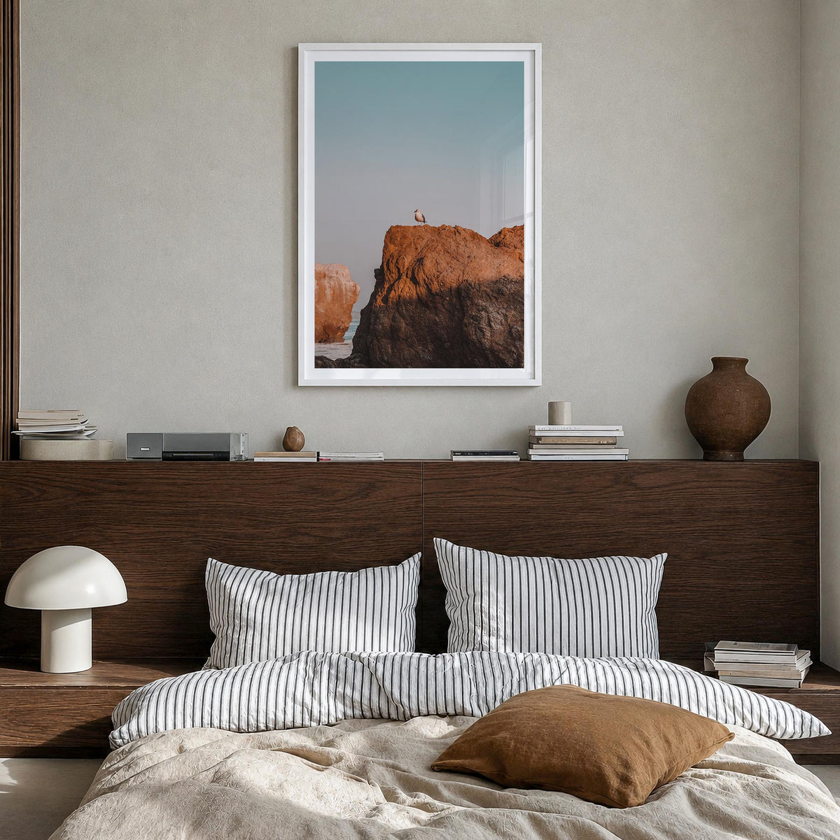 Seagull on a Beach Rock colorful photo poster – vertical wall art in white wood frame with white border, hanging on wall