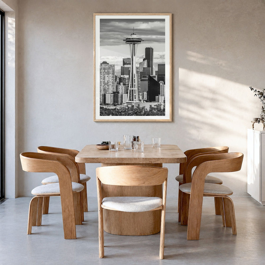Seattle Photo No 1 Poster in a natural wood frame, hanging in a dining room, white border
