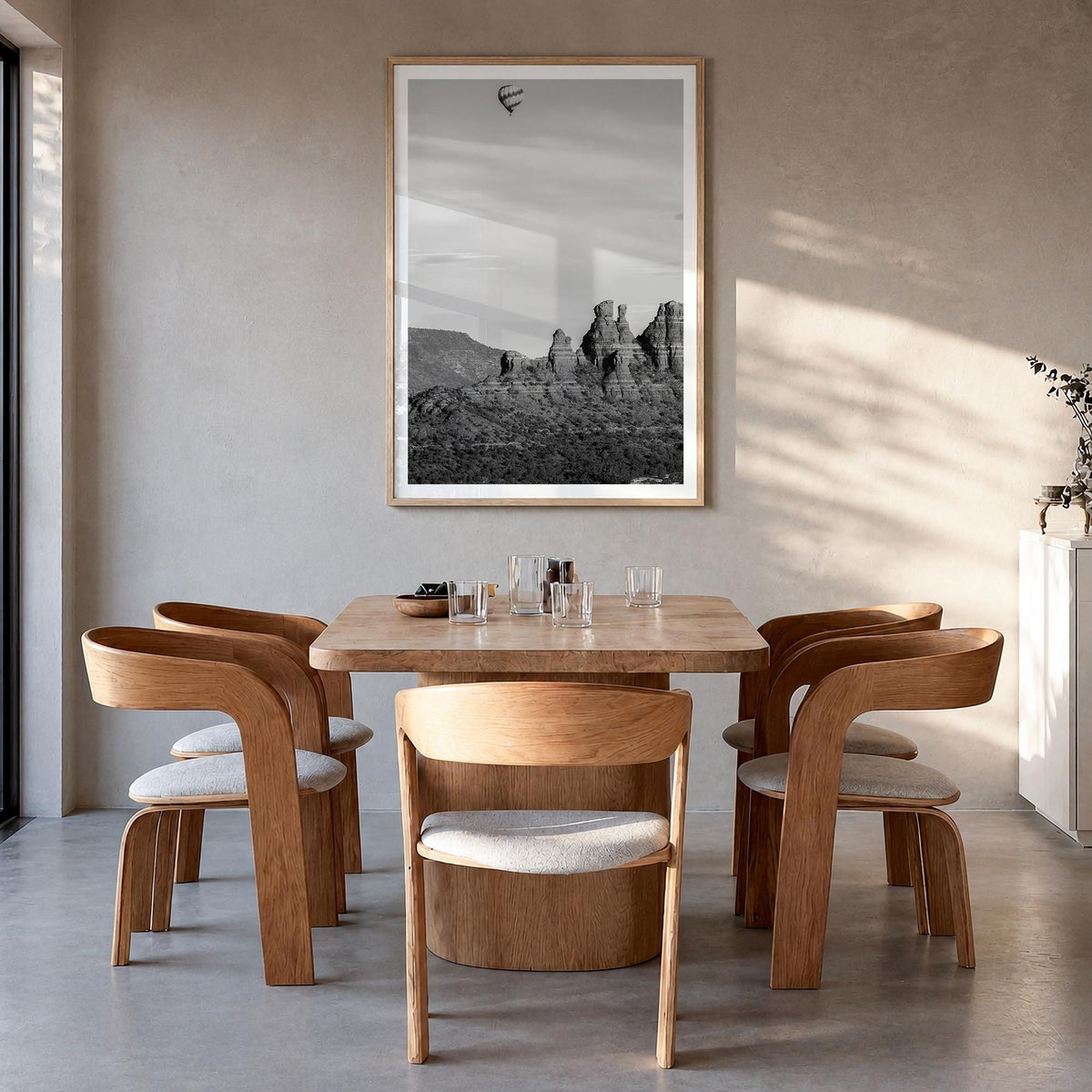 Sedona black & white photo poster of Arizona, USA – vertical wall art in natural wood frame with white border, hanging on wal