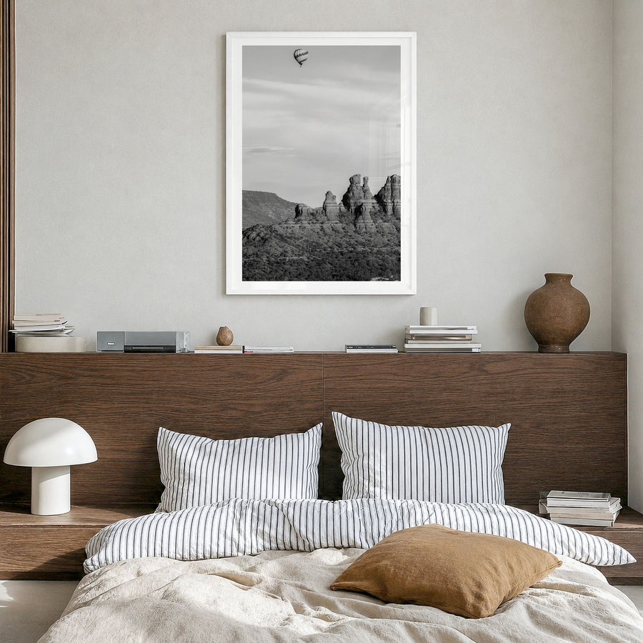 Sedona Photo Poster in a white wood frame, hanging in a bedroom, white border