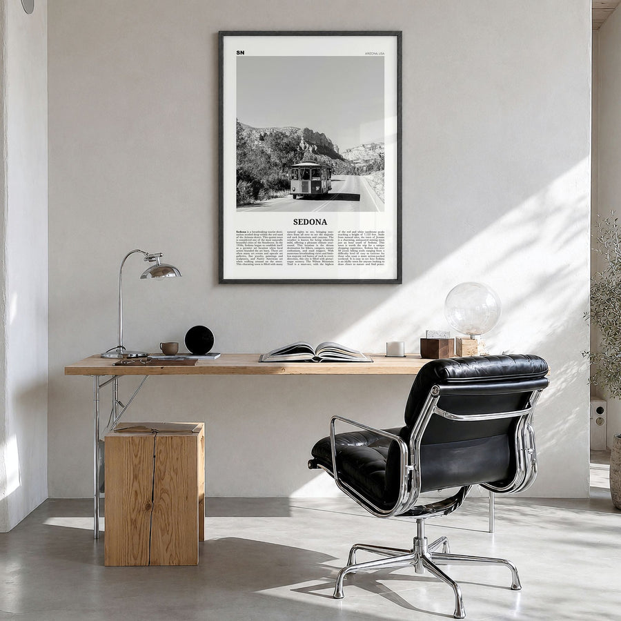 Sedona Newspaper Poster in a black wood frame, hanging in a bright home office