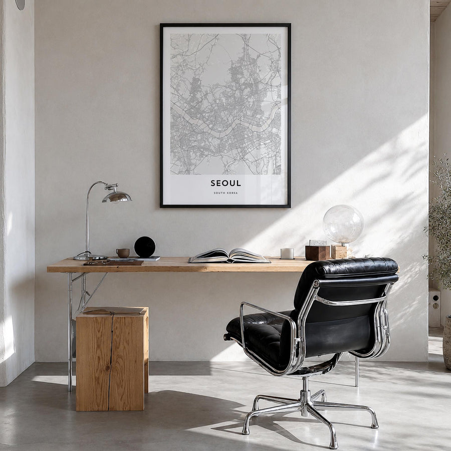 Seoul black & white map poster of South Korea – vertical wall art in black wood frame, hanging on wall