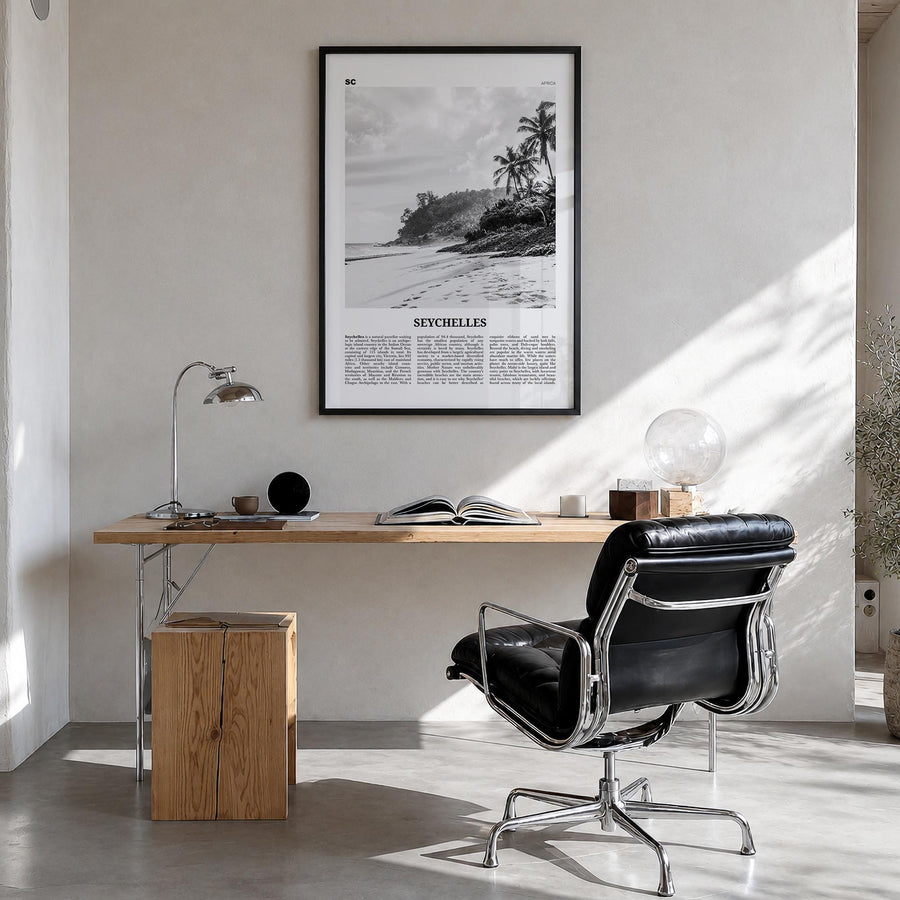 Seychelles black & white newspaper poster of Africa – vertical wall art in black wood frame, hanging on wall