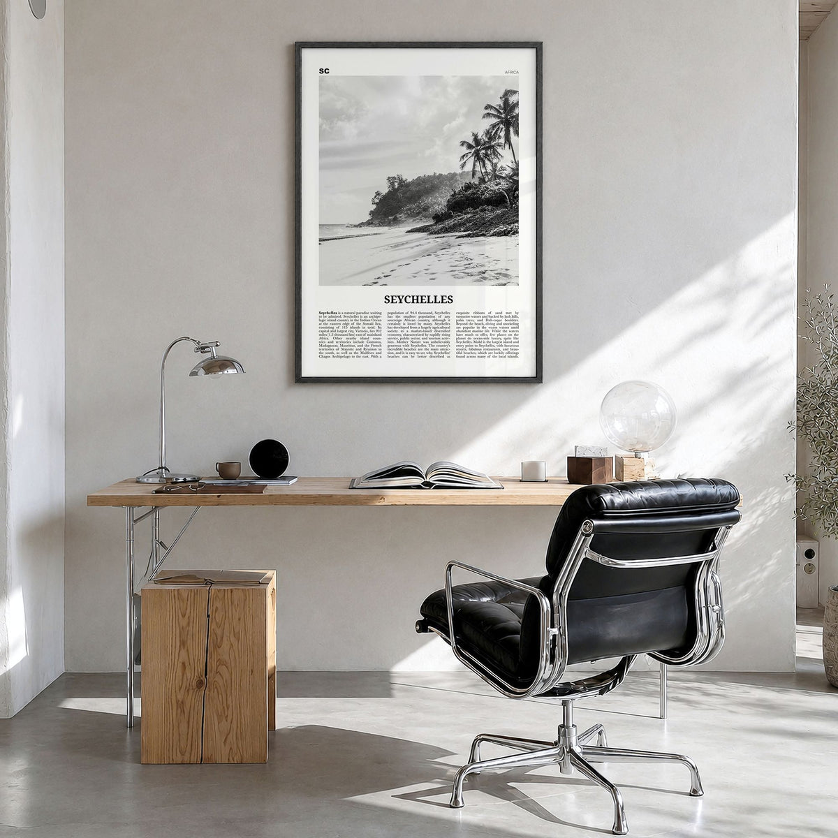 Seychelles Newspaper Poster in a black wood frame, hanging in a bright home office