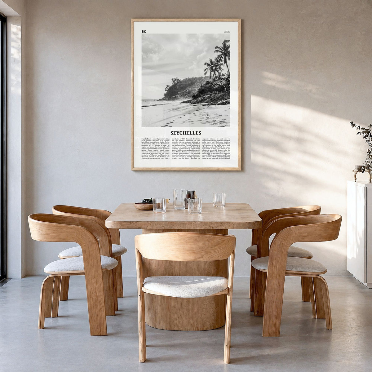 Seychelles Newspaper Poster in a natural wood frame, hanging in a dining room