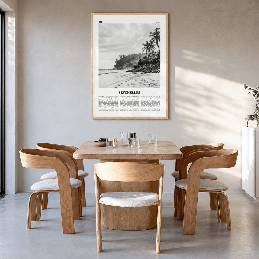 Seychelles Newspaper Poster in a natural wood frame, hanging in a dining room