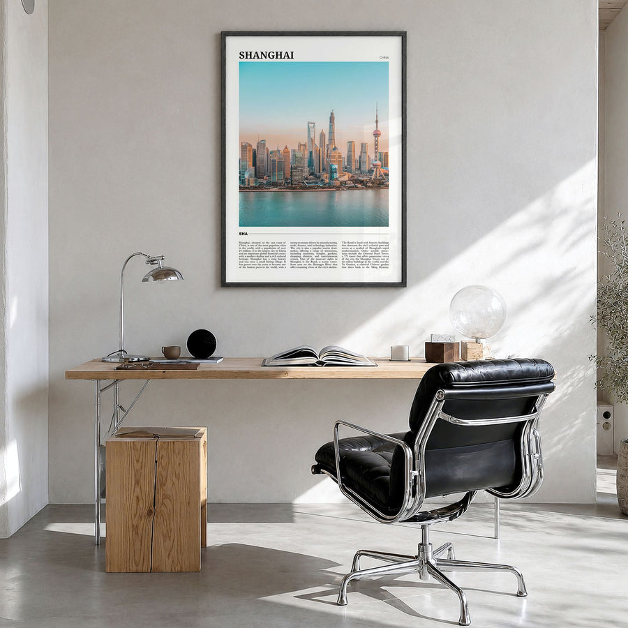 Shanghai Travel Poster in a black wood frame, hanging in a bright home office