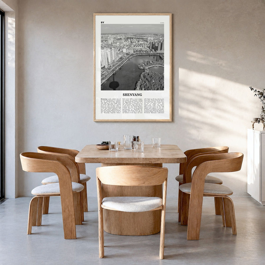 Shenyang Newspaper Poster in a natural wood frame, hanging in a dining room