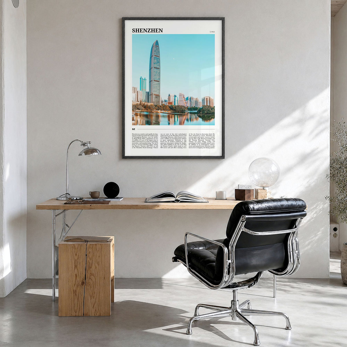 Shenzhen Travel Poster in a black wood frame, hanging in a bright home office