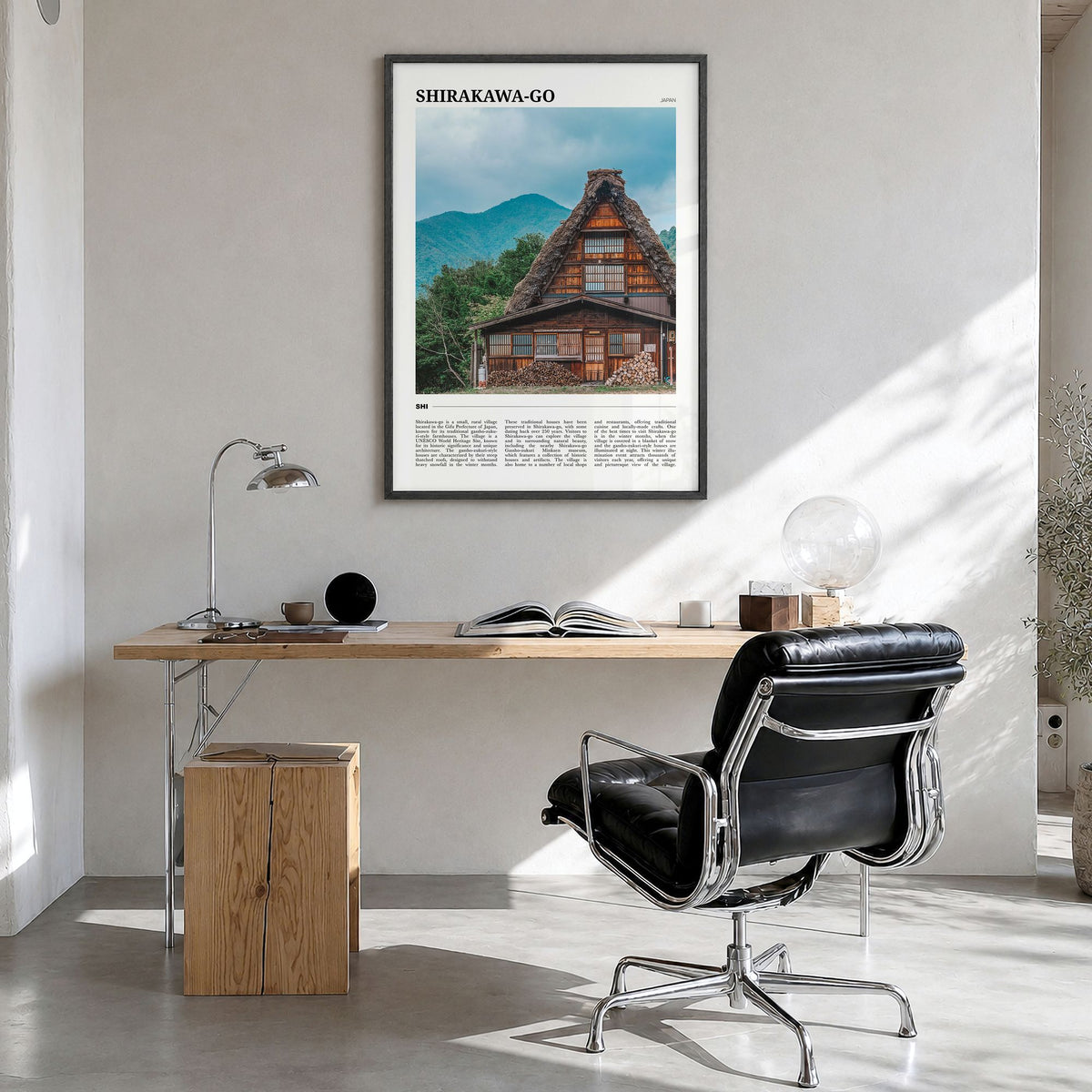 Shirakawa-go Travel Poster in a black wood frame, hanging in a bright home office