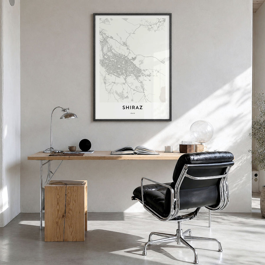 Shiraz Map Poster in a black wood frame, hanging in a bright home office