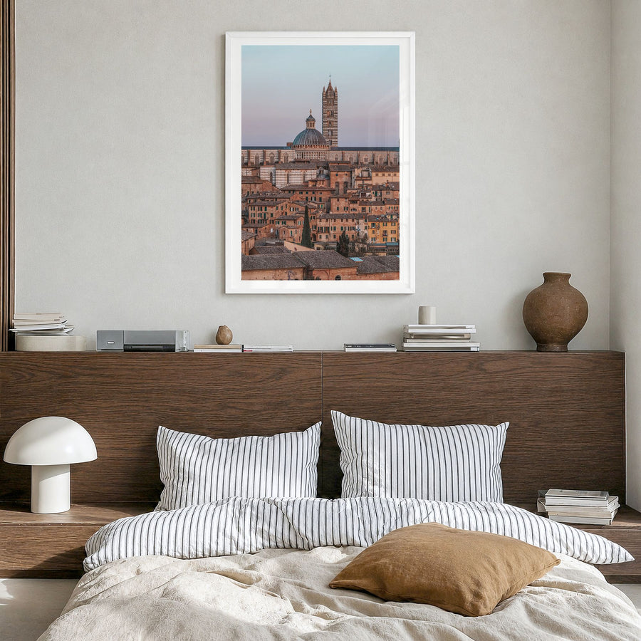 Siena Photo Poster in a white wood frame, hanging in a bedroom, white border