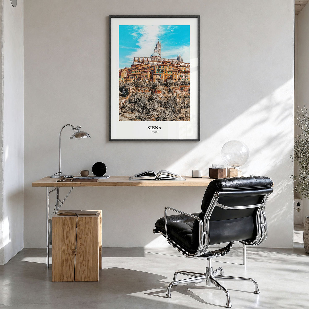 Siena Classic Poster in a black wood frame, hanging in a bright home office