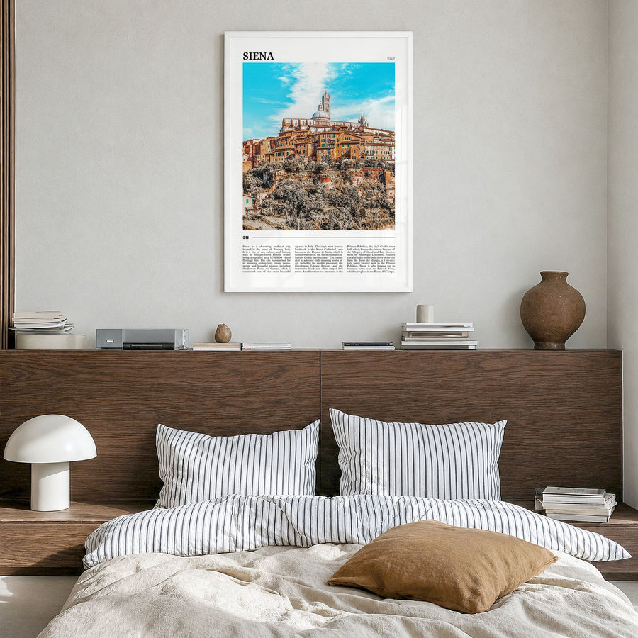 Siena Travel Poster in a white wood frame, hanging in a bedroom