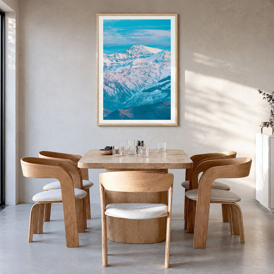 Sierra Nevada Photo Poster in a natural wood frame, hanging in a dining room, white border