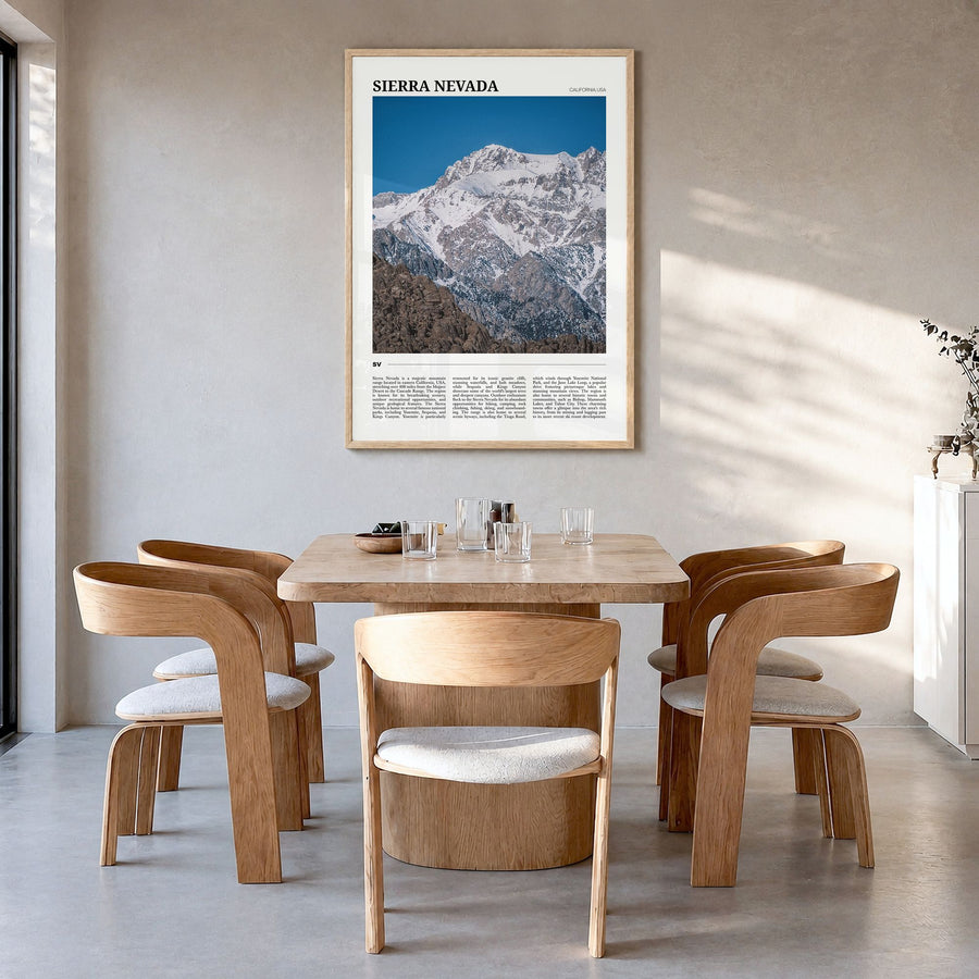 Sierra Nevada Travel Poster in a natural wood frame, hanging in a dining room