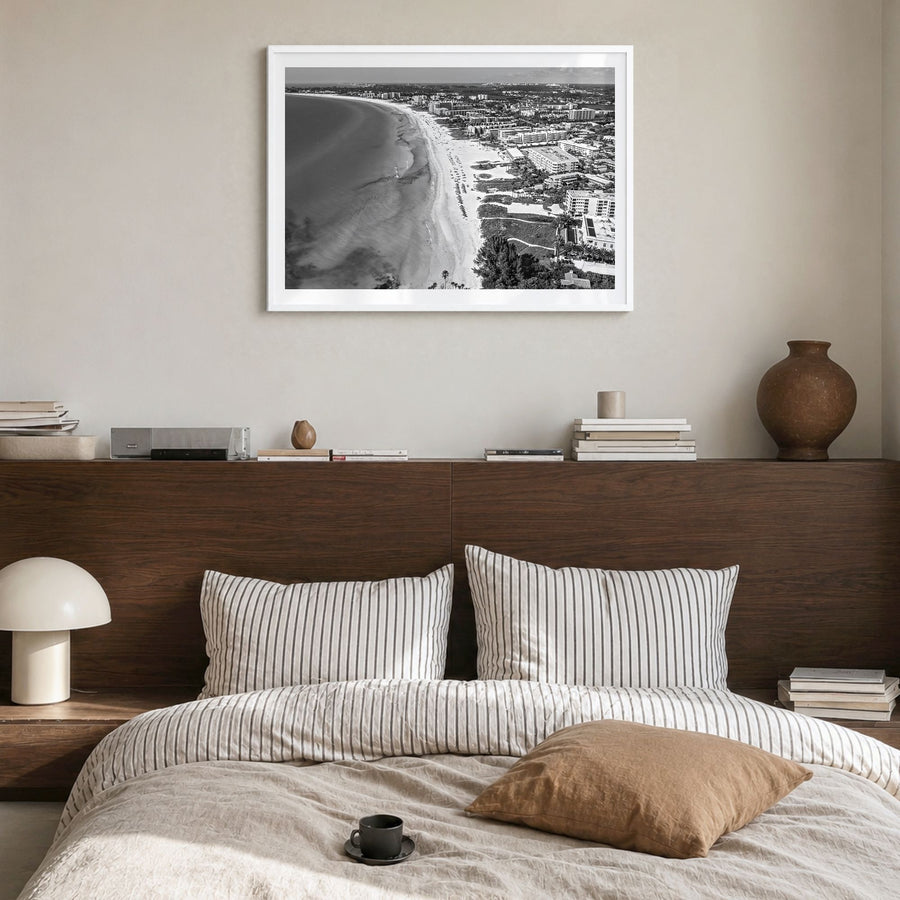 Siesta Key Photo Poster in a white wood frame, hanging in a bedroom, white border