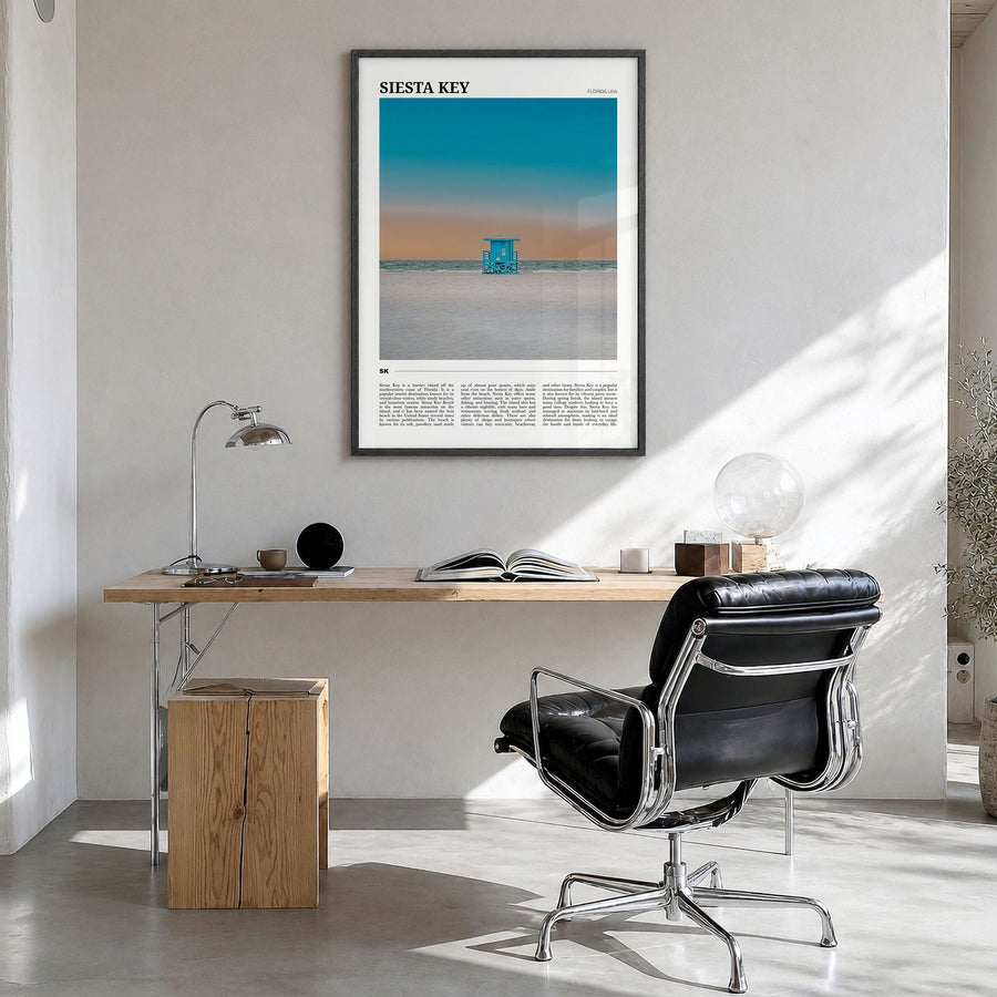Siesta Key Travel Poster in a black wood frame, hanging in a bright home office