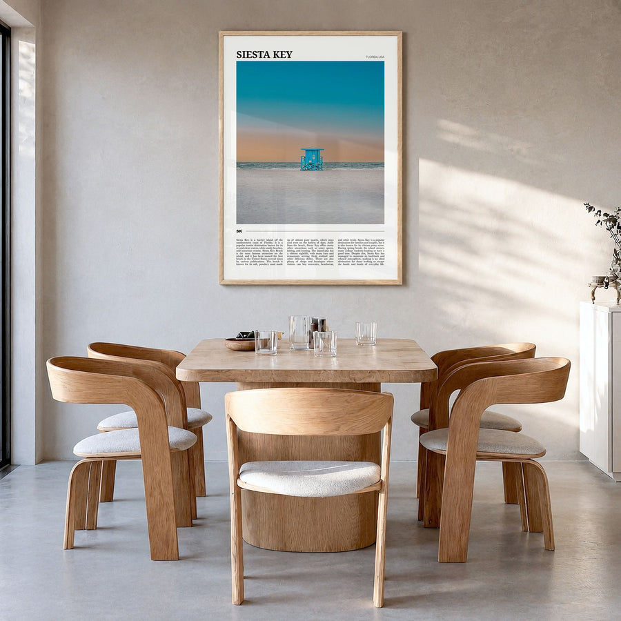 Siesta Key Travel Poster in a natural wood frame, hanging in a dining room