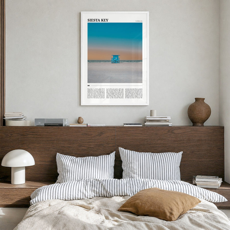 Siesta Key Travel Poster in a white wood frame, hanging in a bedroom