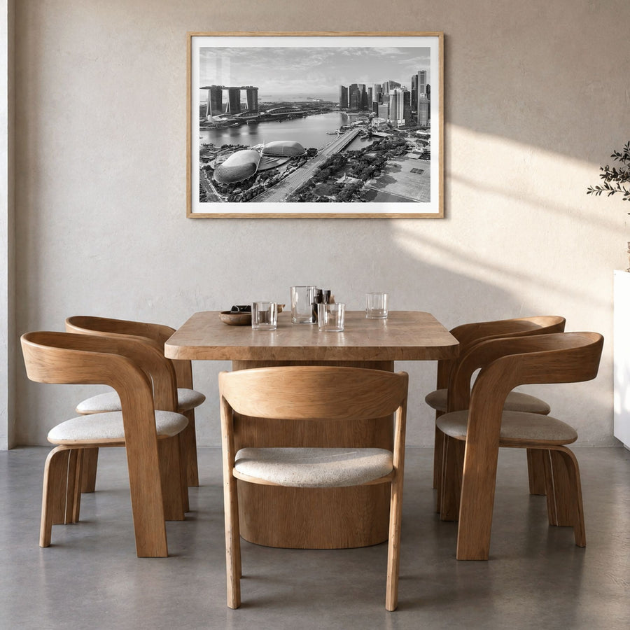 Singapore Photo Poster in a natural wood frame, hanging in a dining room, white border