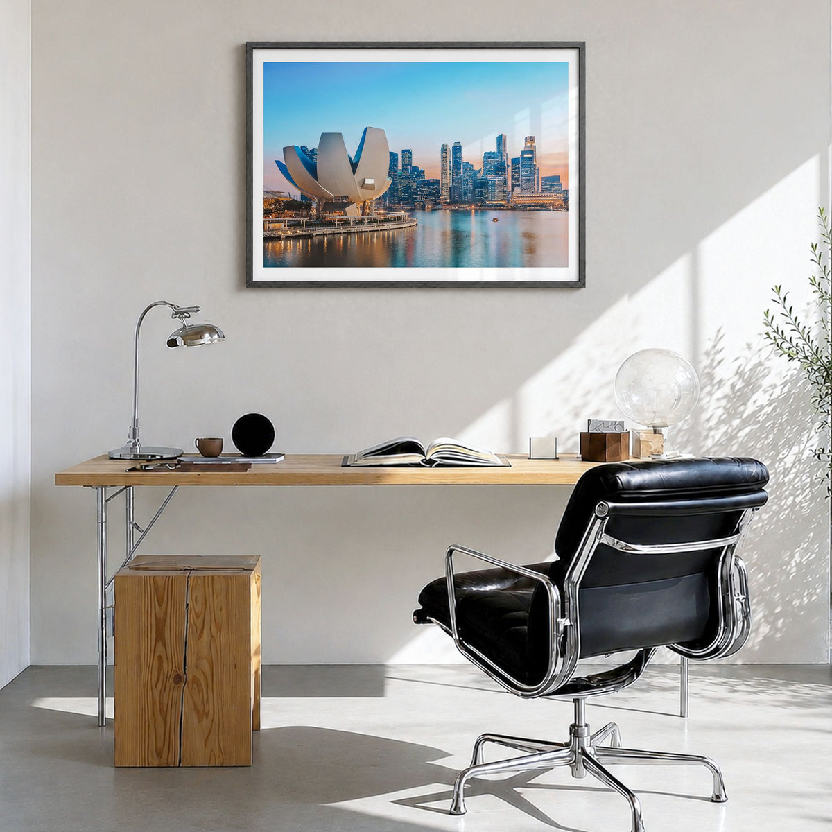 Singapore Photo Poster in a black wood frame, hanging in a bright home office, white border
