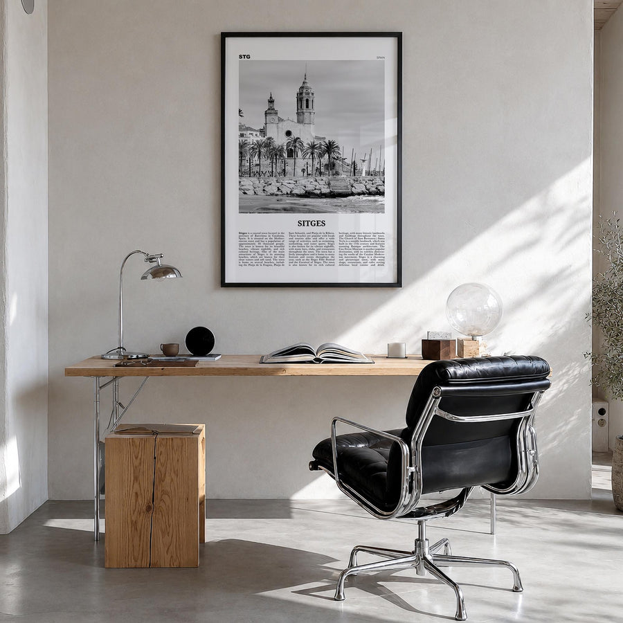 Sitges black & white newspaper poster of Spain – vertical wall art in black wood frame, hanging on wall