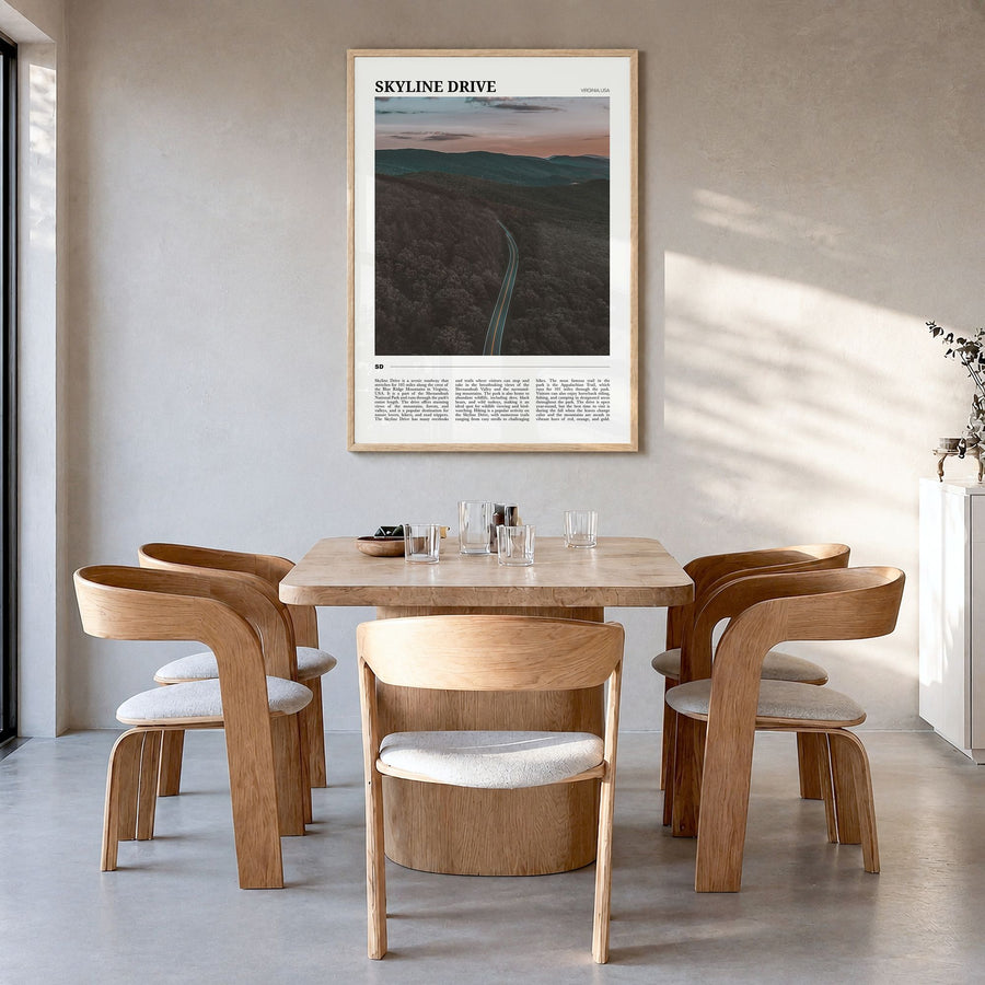 Skyline Drive Travel Poster in a natural wood frame, hanging in a dining room