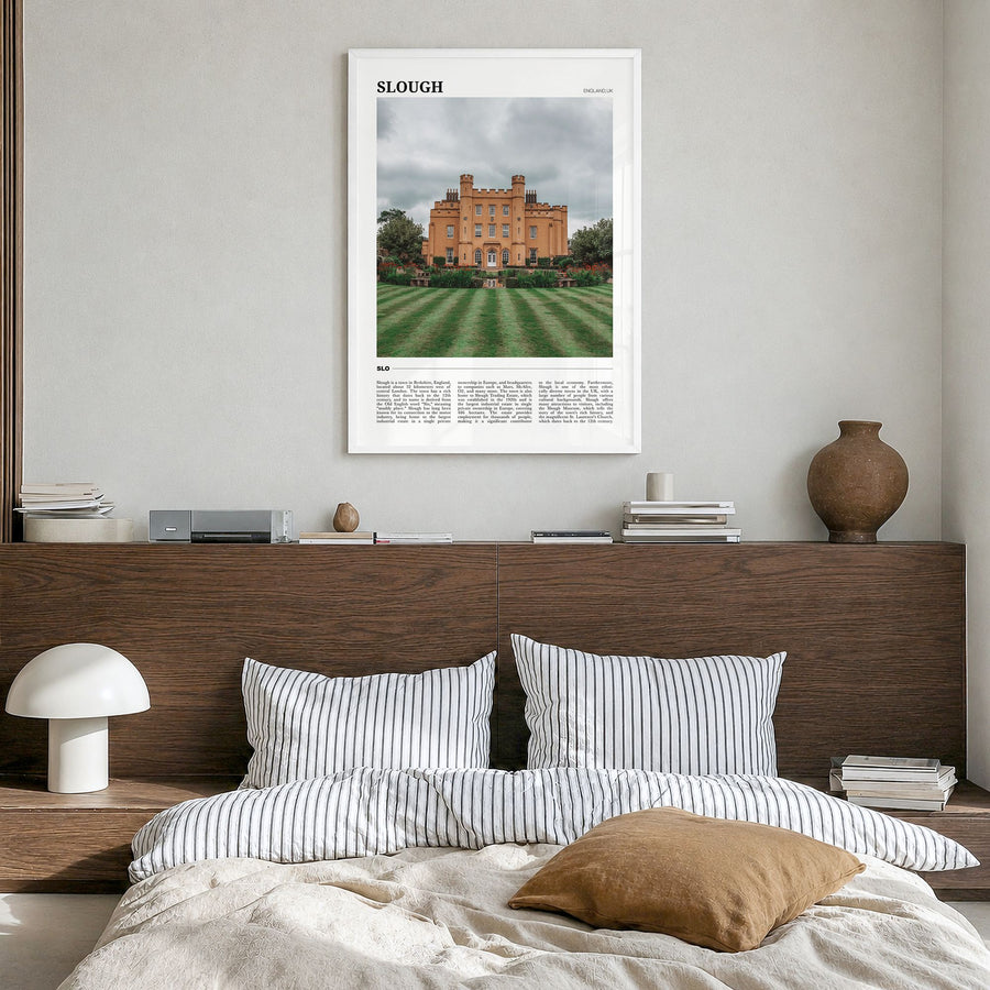 Slough Travel Poster in a white wood frame, hanging in a bedroom