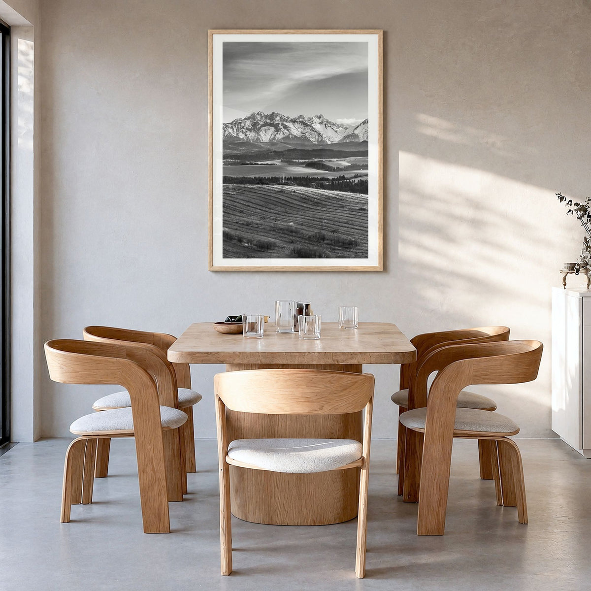 Slovakia Photo Poster in a natural wood frame, hanging in a dining room, white border