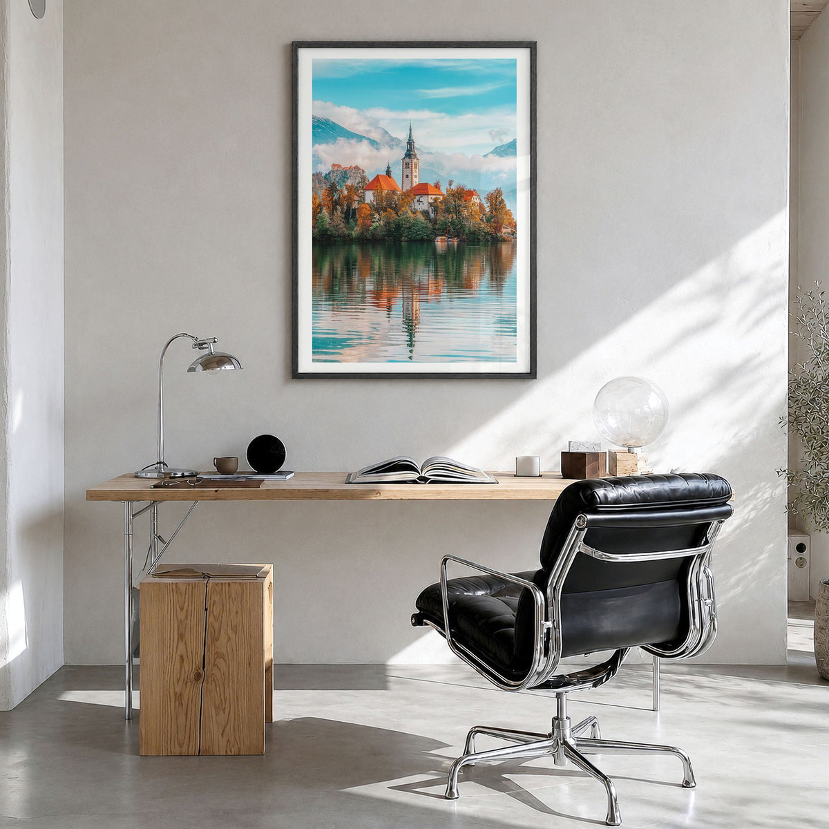 Slovenia Photo Poster in a black wood frame, hanging in a bright home office, white border