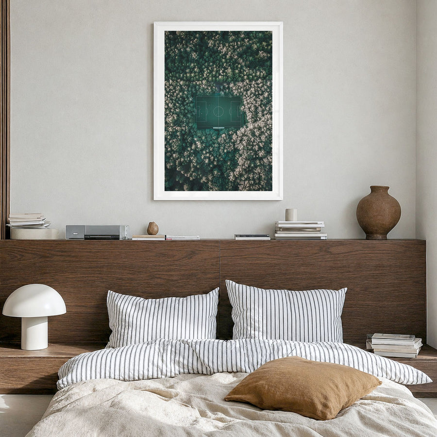 Soccer Field Photo Poster in a white wood frame, hanging in a bedroom, white border