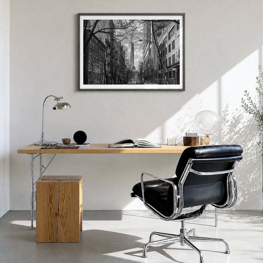 SoHo, New York City Photo Poster in a black wood frame, hanging in a bright home office, white border