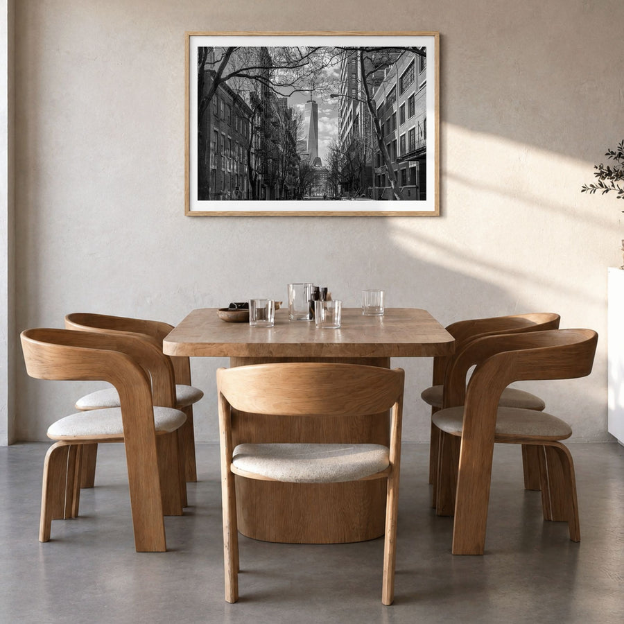 SoHo, New York City Photo Poster in a natural wood frame, hanging in a dining room, white border
