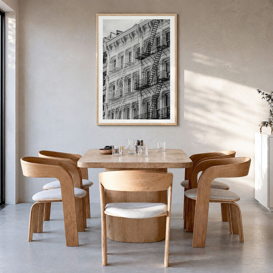 SoHo, New York City Photo Poster in a natural wood frame, hanging in a dining room, white border
