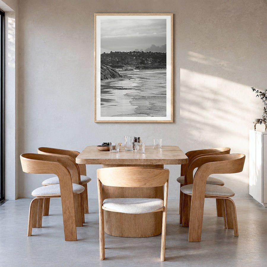 Solana Beach Photo Poster in a natural wood frame, hanging in a dining room, white border