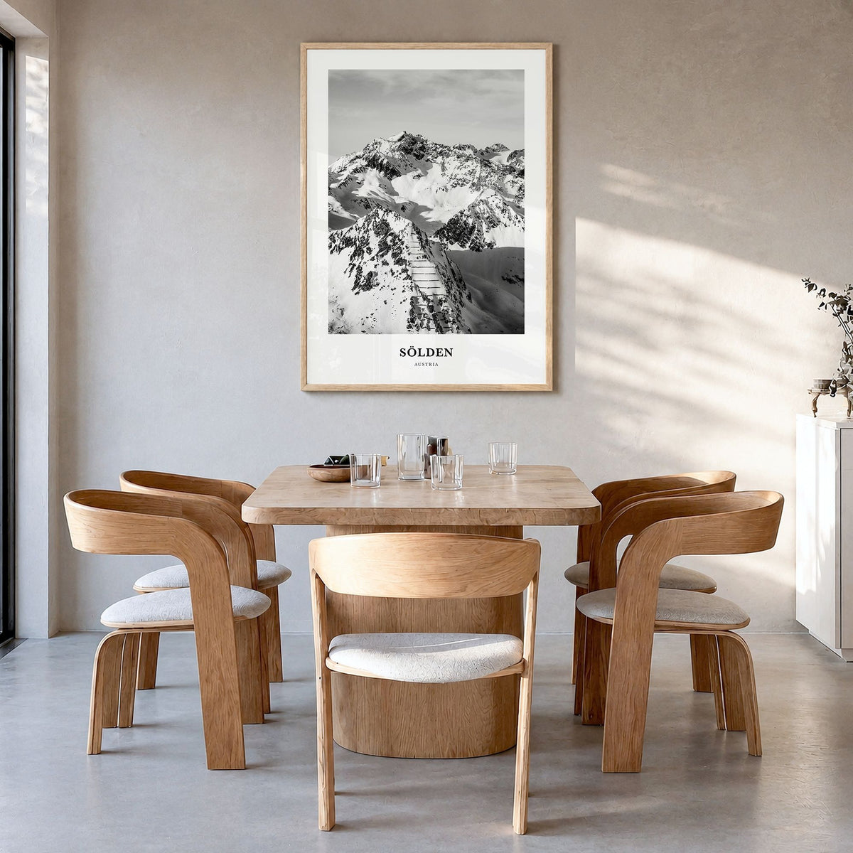 Sölden Classic Poster in a natural wood frame, hanging in a dining room
