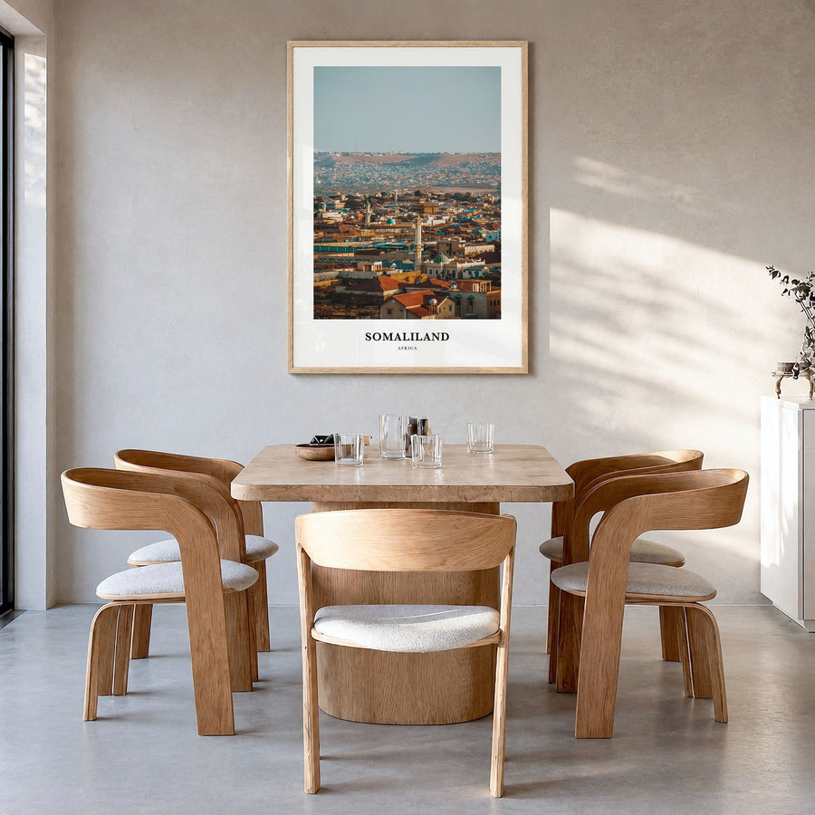 Somaliland Classic Poster in a natural wood frame, hanging in a dining room