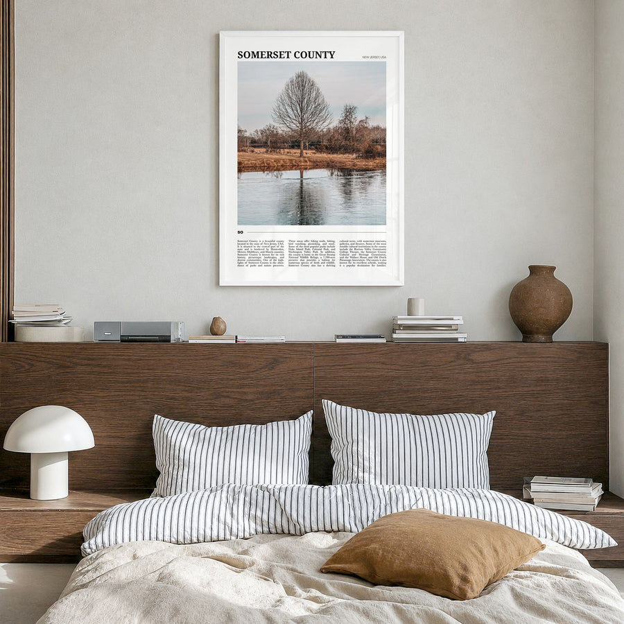 Somerset County Travel Poster in a white wood frame, hanging in a bedroom