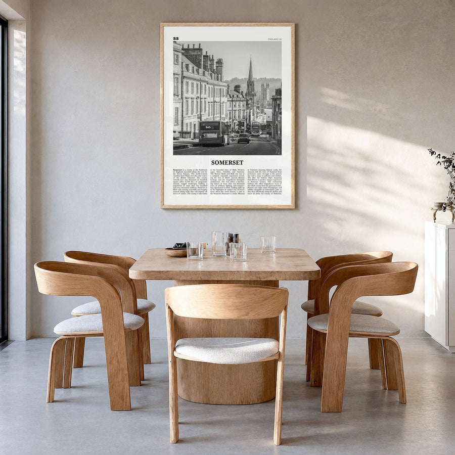 Somerset Newspaper Poster in a natural wood frame, hanging in a dining room