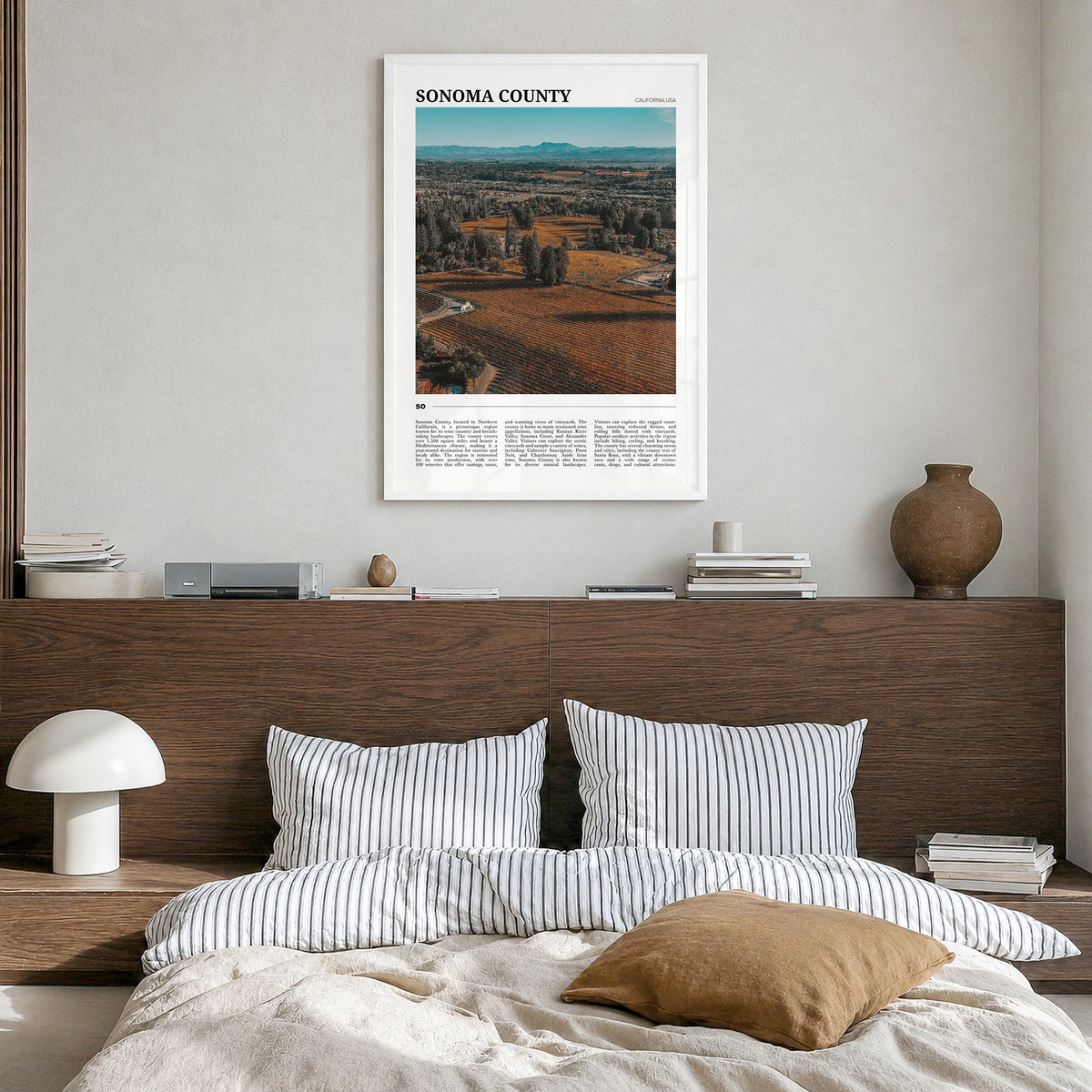 Sonoma County Travel Poster in a white wood frame, hanging in a bedroom